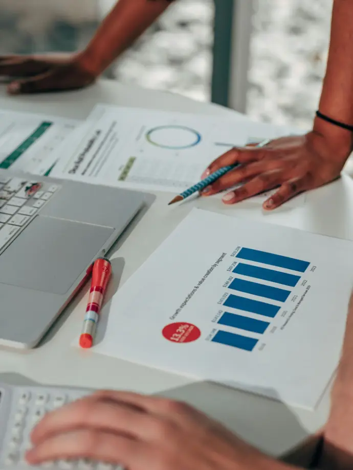 Precision in Business Report Review Symbolizing the act of editing, annotating, or refining strategies. This visual represents meticulous attention to detail and professionalism in reviewing business reports.