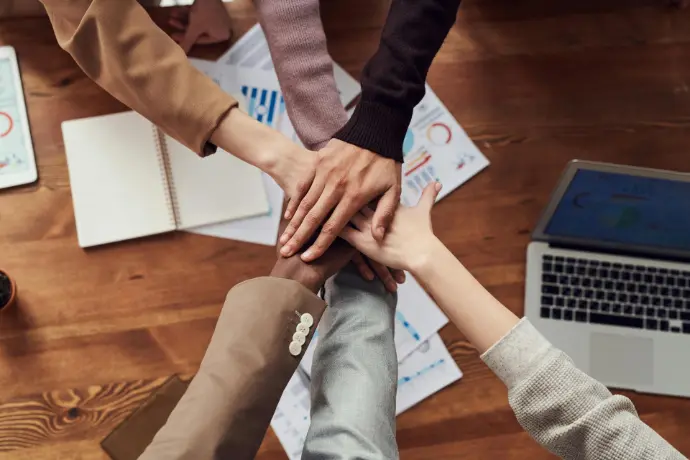Teamwork and Collaboration in Business Success Representing collaboration and unity within a team. This image signifies the importance of teamwork and shared efforts in achieving business goals and fostering a positive work culture.